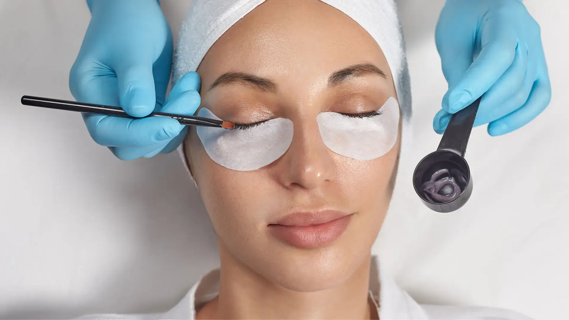 Woman getting her eyelashes tinted